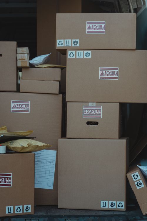 Online sourcing scene showing boxes and packages being prepared for shipping