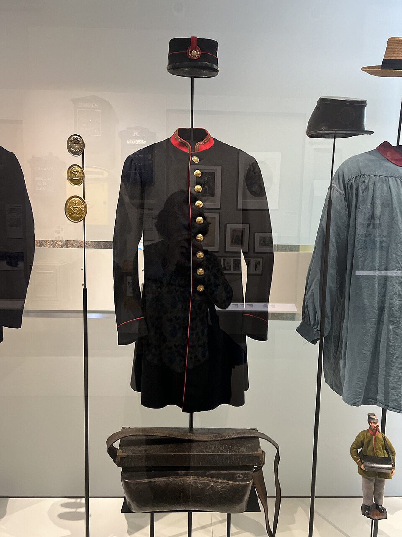 Historic postal carrier uniform in a museum display