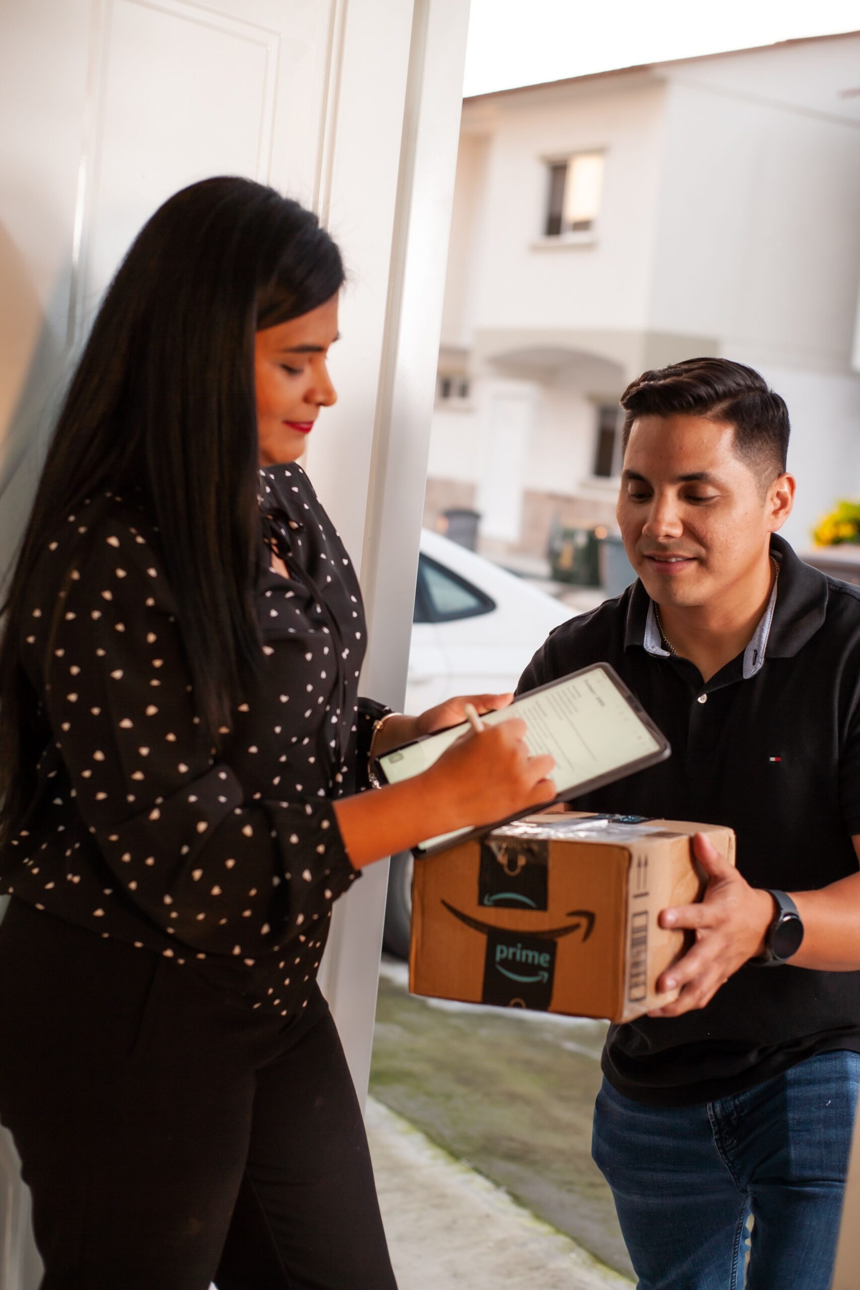 Courier handing over parcels to customer