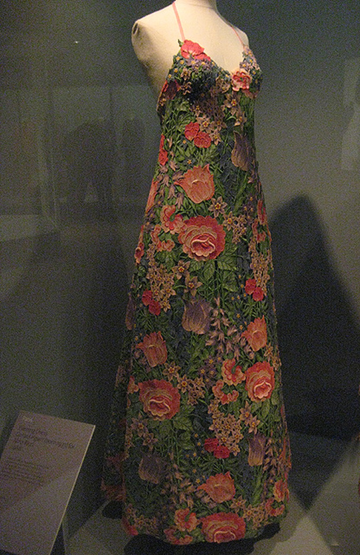 Evening dress displayed in a museum gallery