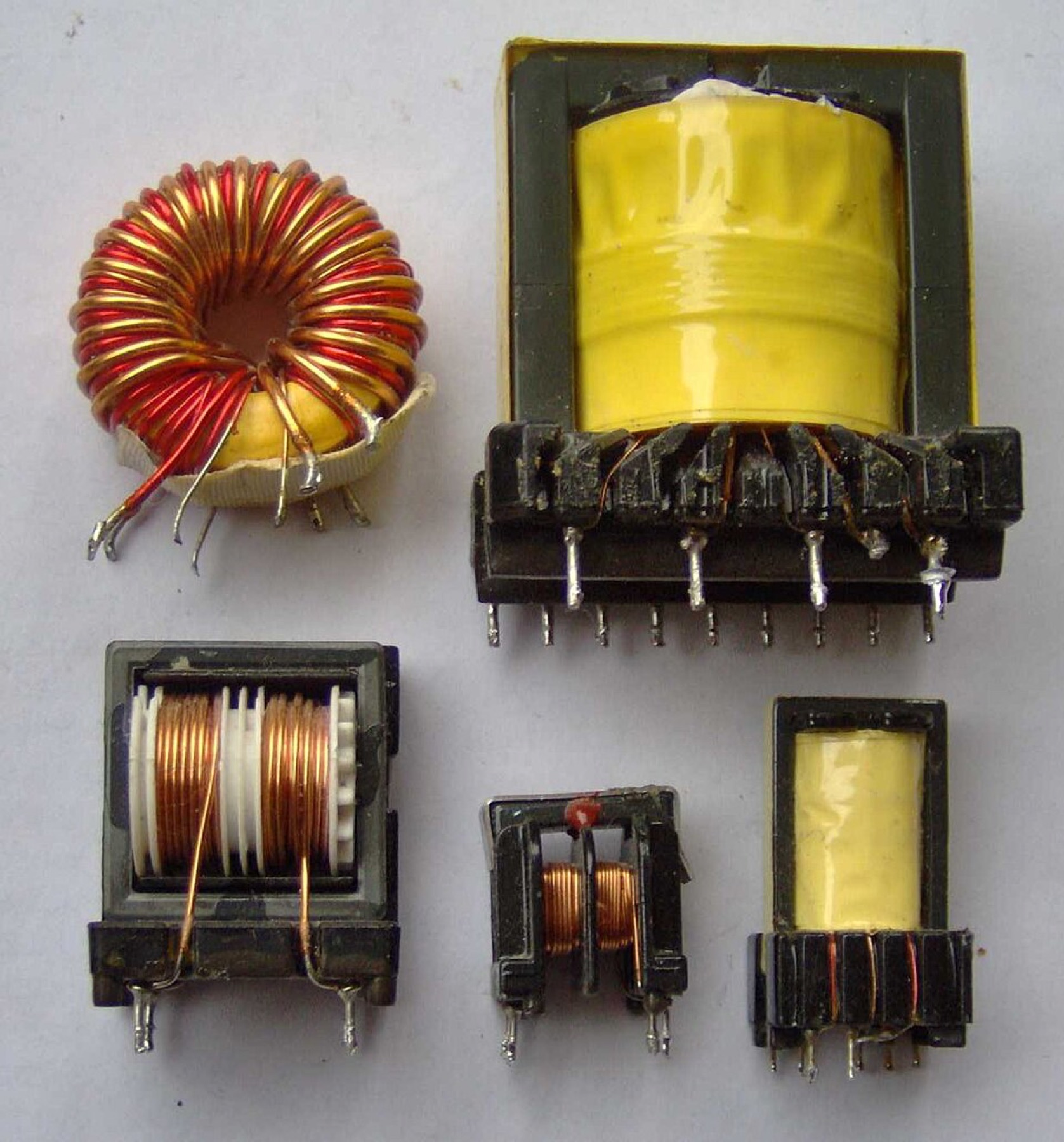 Close-up of several power transformers used in electronic equipment