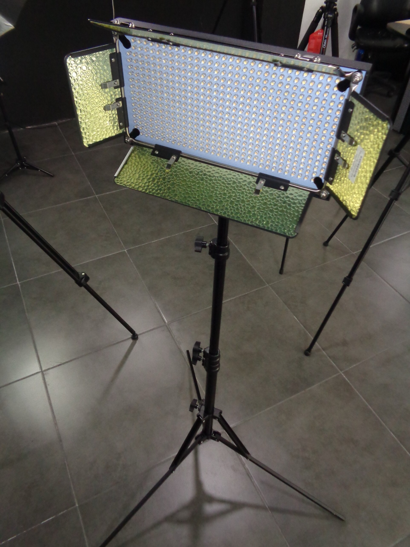 Studio lighting equipment on a tripod in a photography setup
