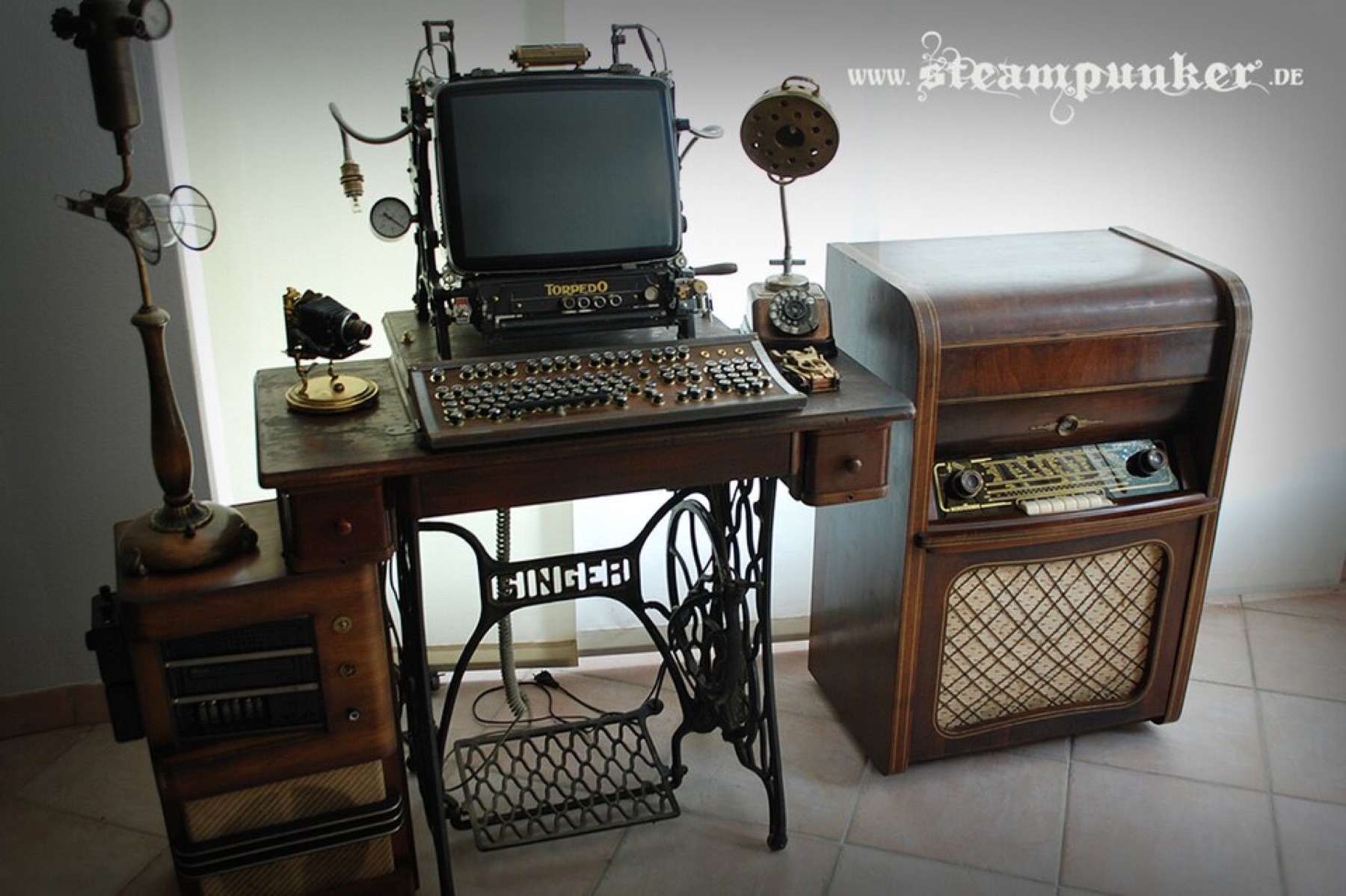 Steampunk-style computer workstation with brass and wood elements