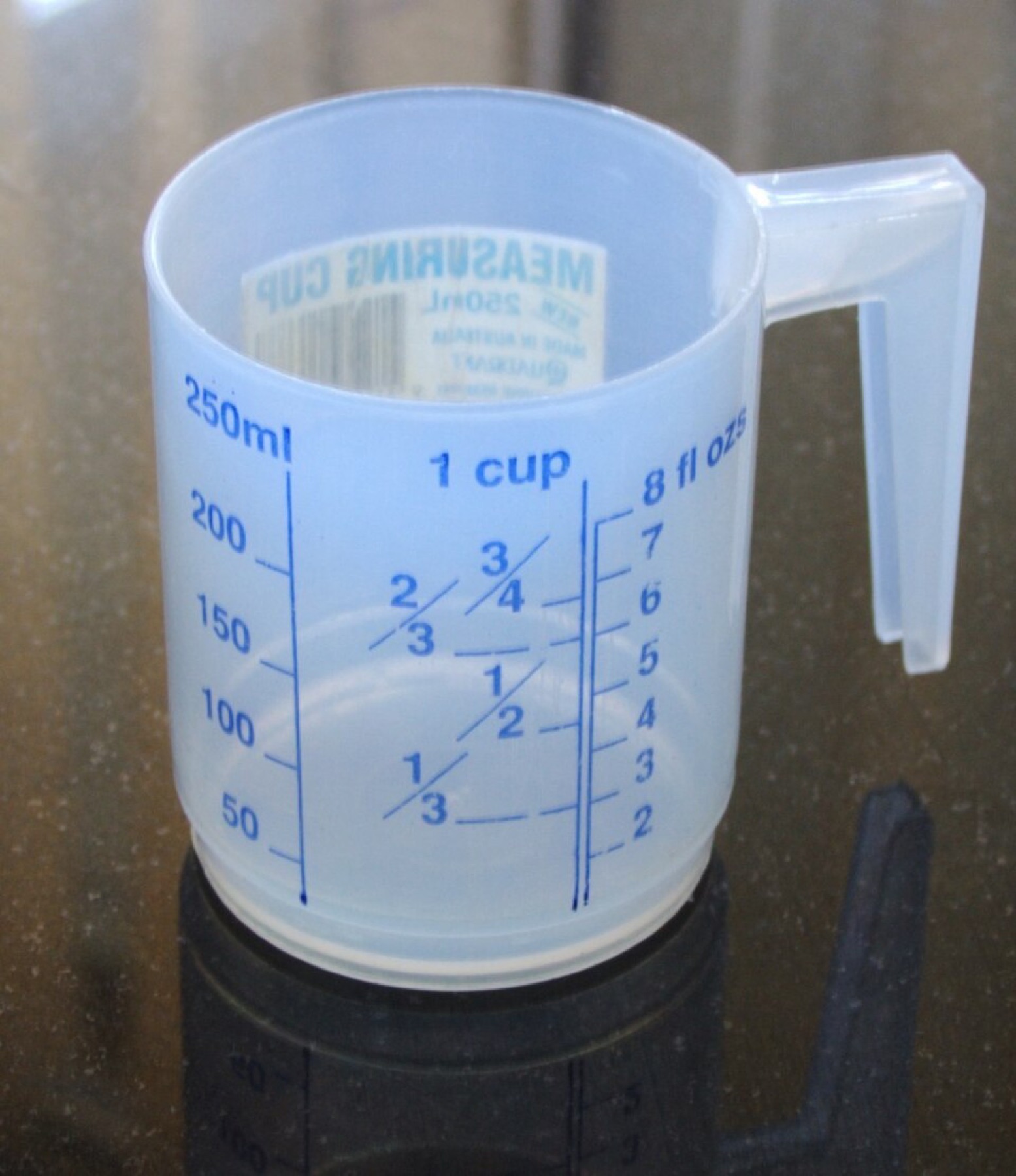 Simple transparent measuring cup with visible scale