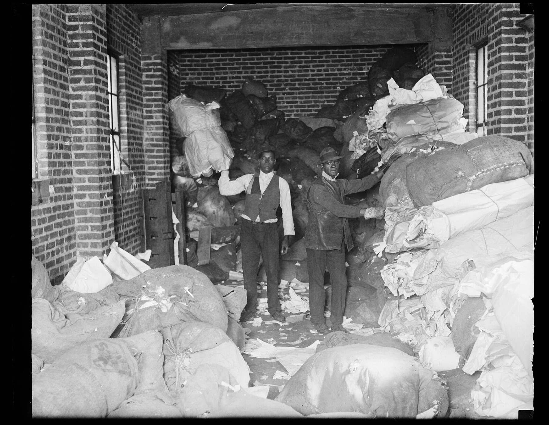 Workers handling large bags