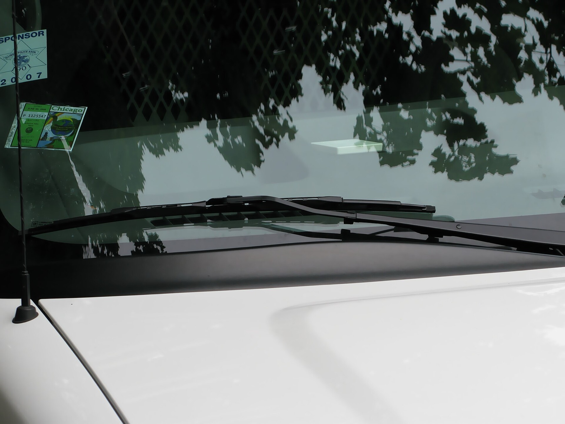 Windshield wiper in motion on a wet windshield