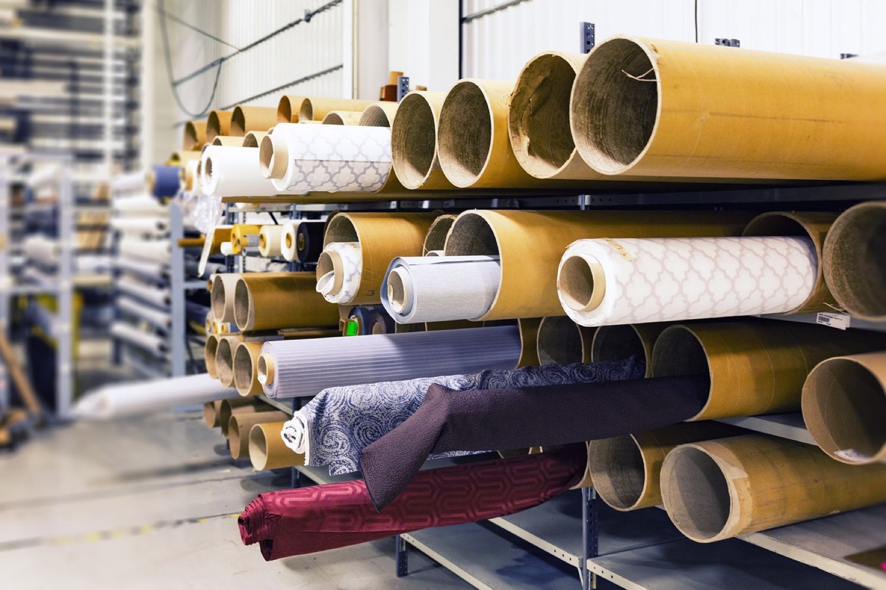 Person using a laptop to compare textile suppliers online