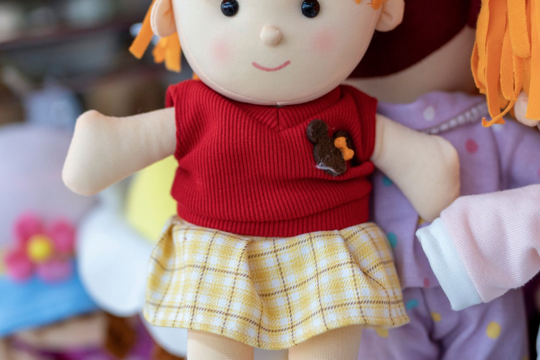 Plush dolls displayed in a store, illustrating retail vs marketplace sourcing