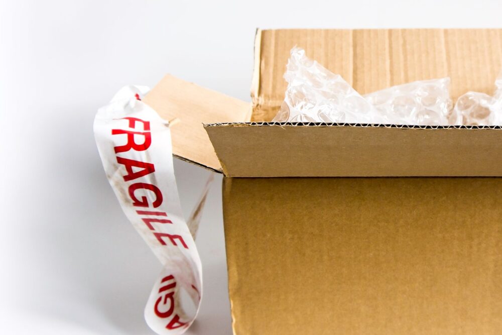 Online sourcing scene illustrating DHgate vs other channels for Shipping supplies and packaging vendors