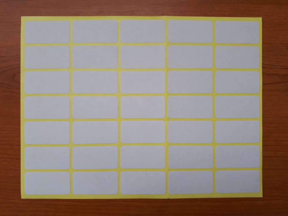 Sheet of 35 blank adhesive labels arranged for printing and application