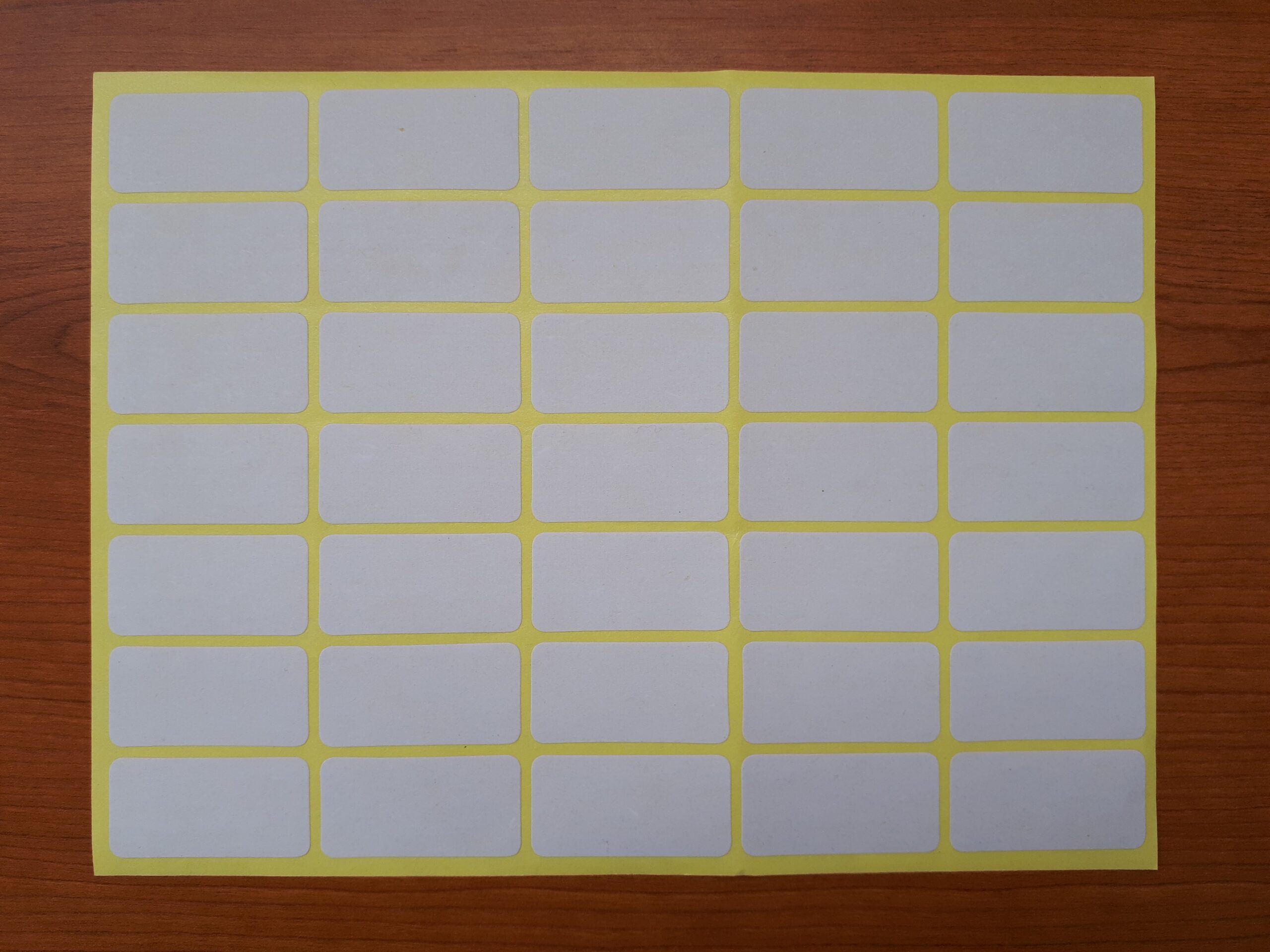 Sheet of 35 blank adhesive labels arranged for printing and application