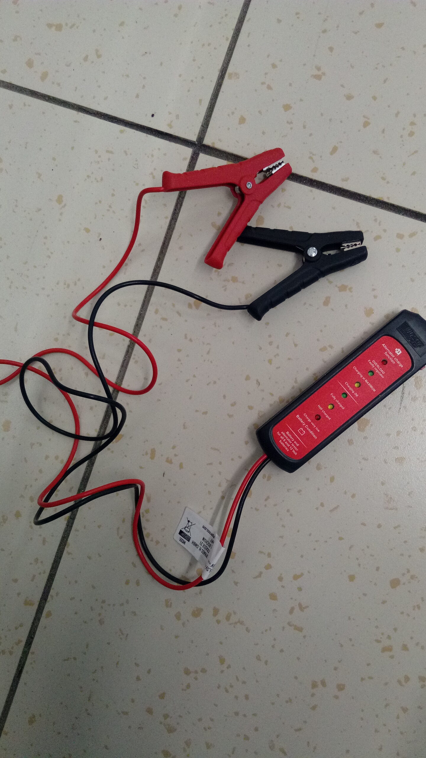 Car battery and alternator tester with red and black clamps