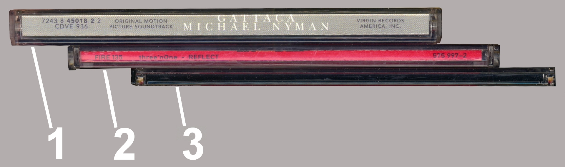 Three optical-disc packaging formats: a standard jewel case, a CD single case, and a slim case
