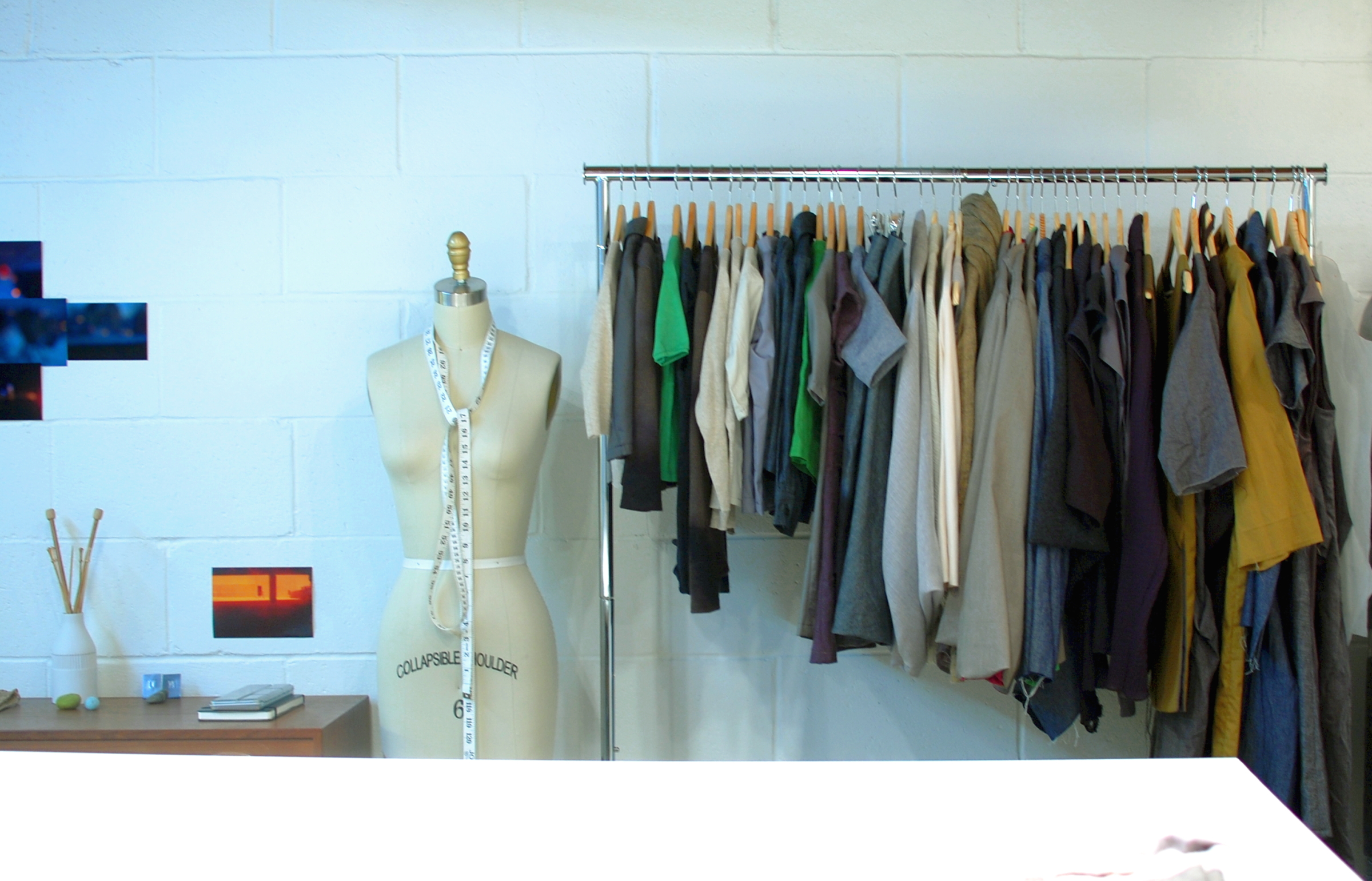 Clothing samples and works in progress on a garment rack, used here as a neutral view of apparel assortment
