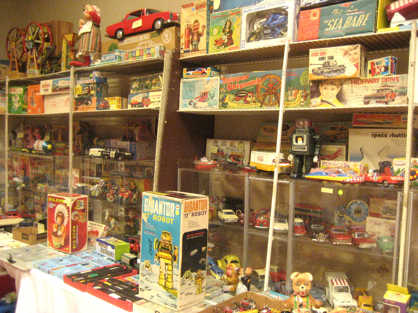 Antique toys displayed for sale, illustrating why age, condition and completeness must be compared separately
