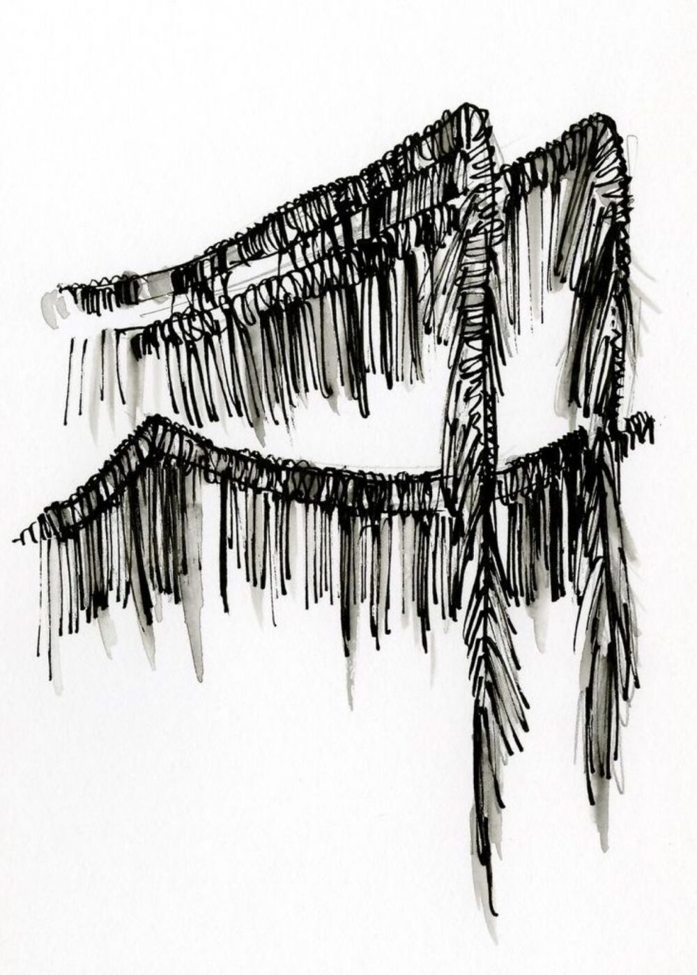 Fabric fringe draped over a chair, showing strand length and edge construction