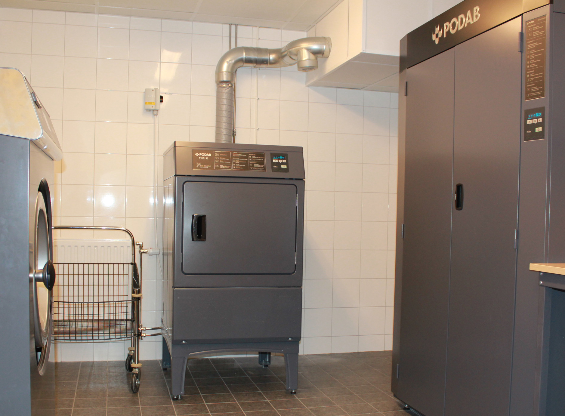 Front-loading clothes dryer used to illustrate the appliance-repair context