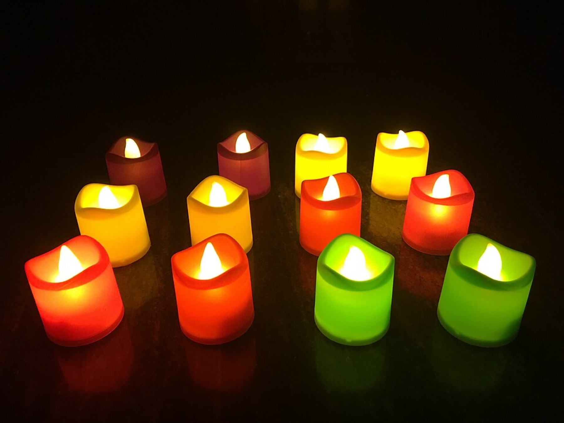 Battery-operated LED tea lights arranged on a table for decorative lighting