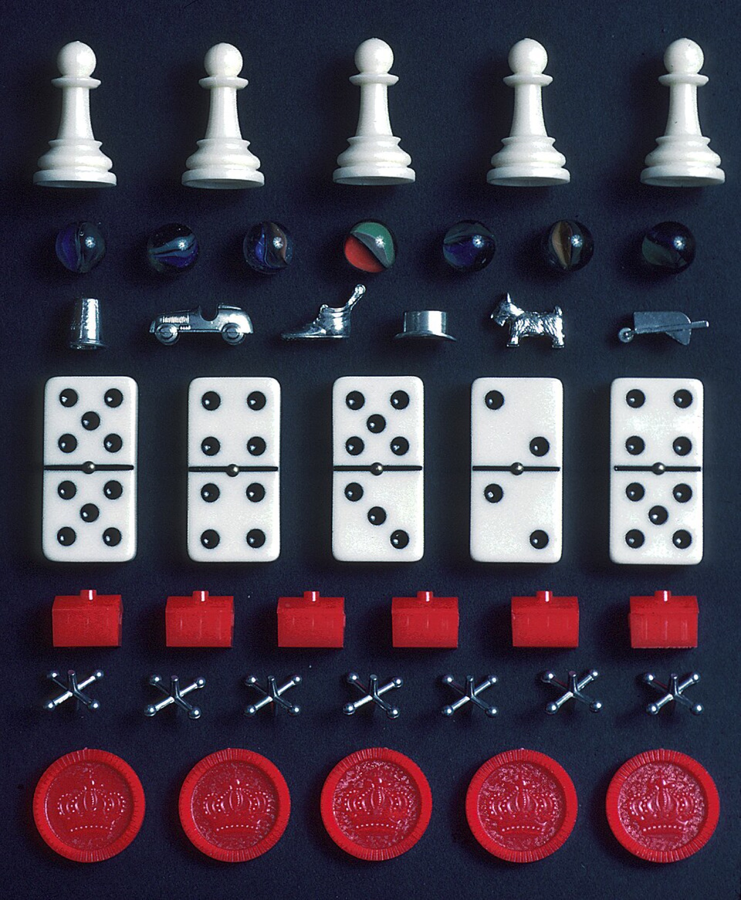 Assorted board game pieces including pawns, cubes, and tokens