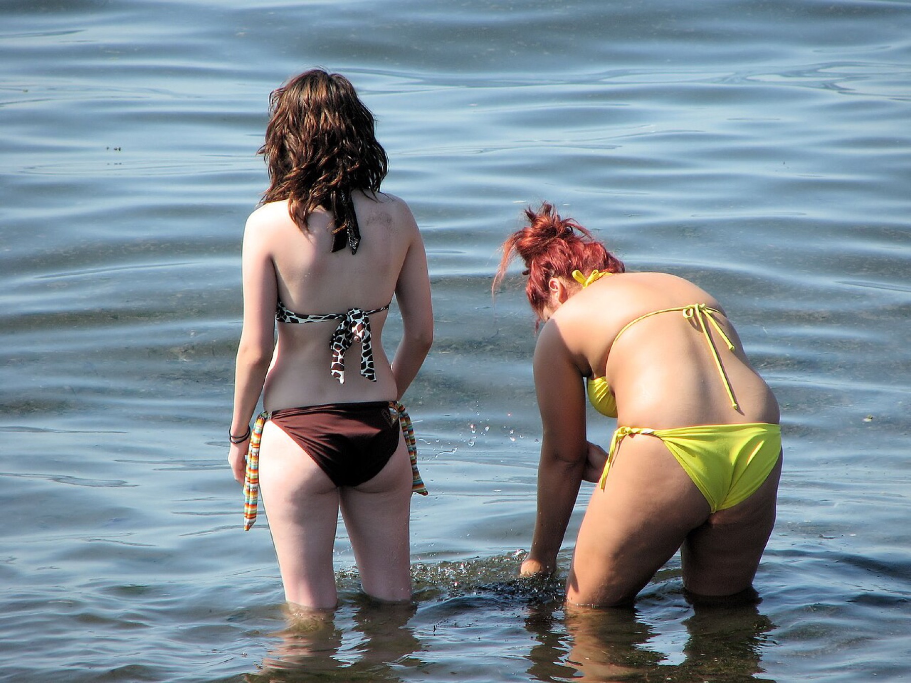 Woman in a bikini on a beach, representing swimwear comparison
