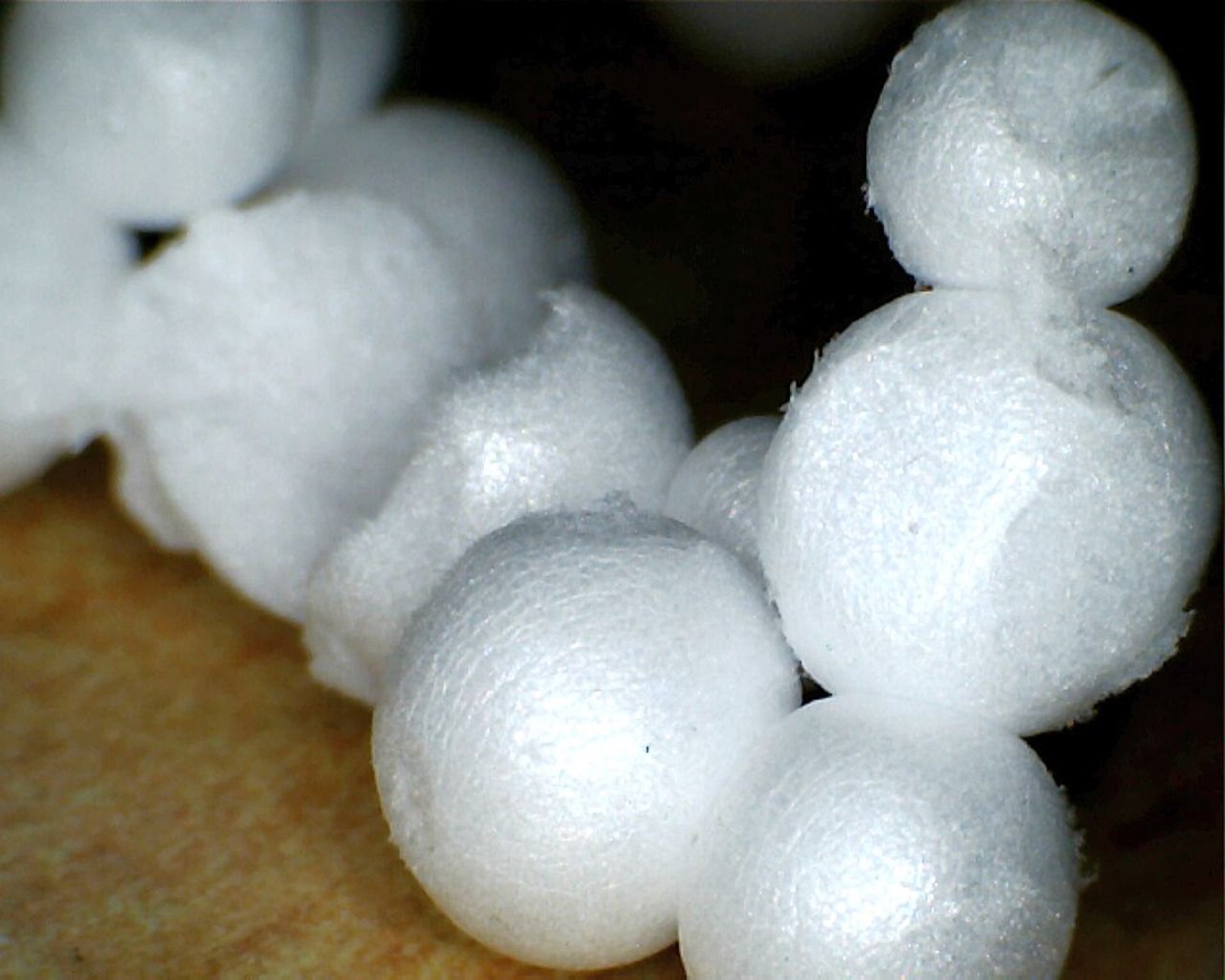 White Styrofoam balls of different sizes on a table