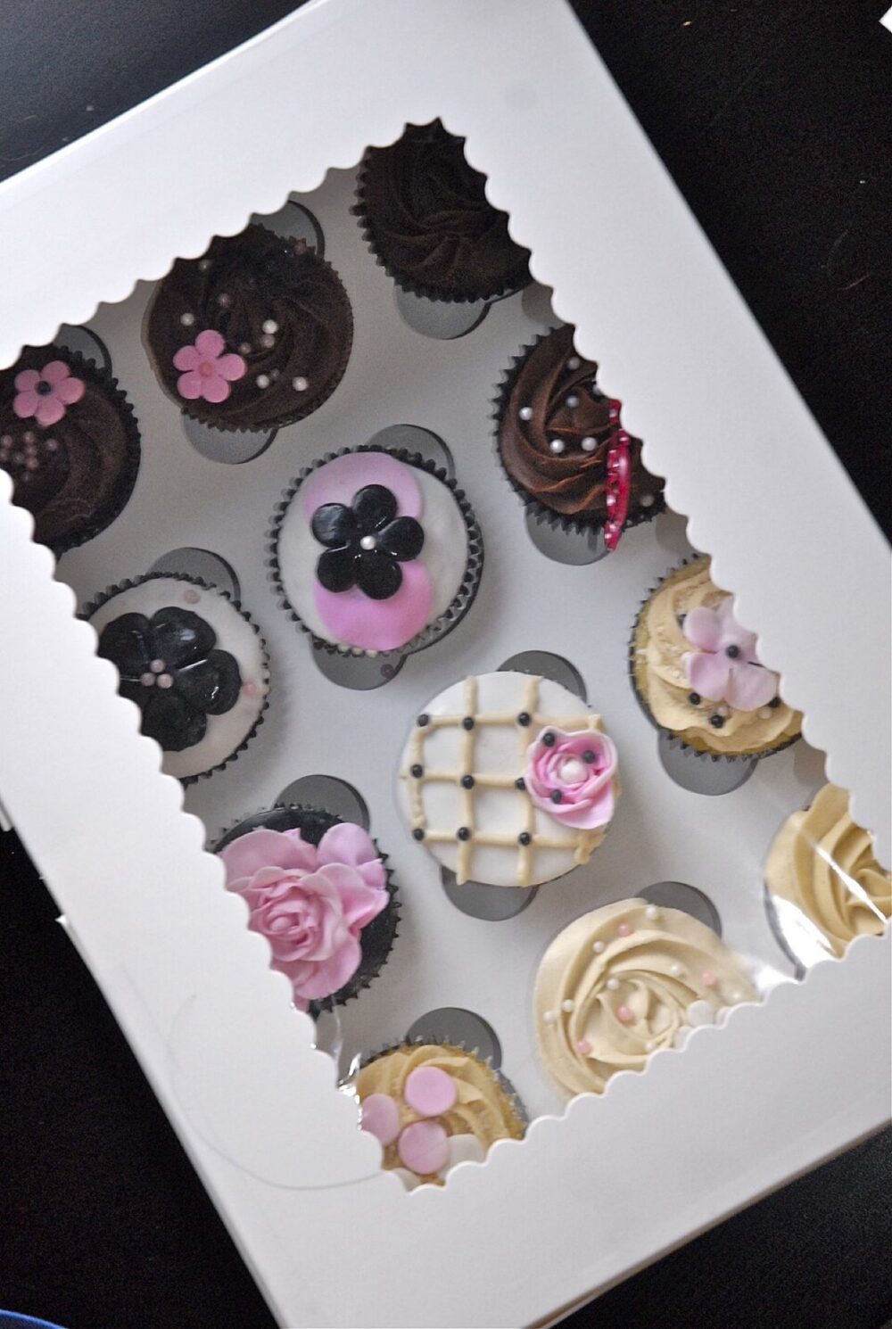 Clear cupcake boxes stacked in a carton