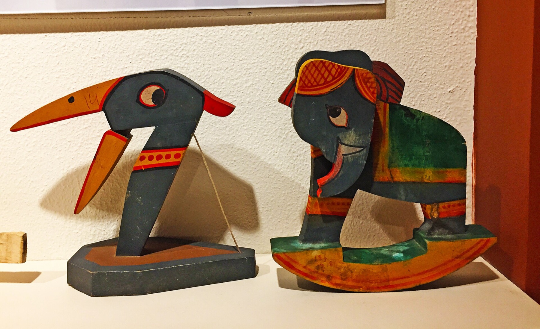 Assorted wooden toys that illustrate how eyes and facial details affect finished craft products