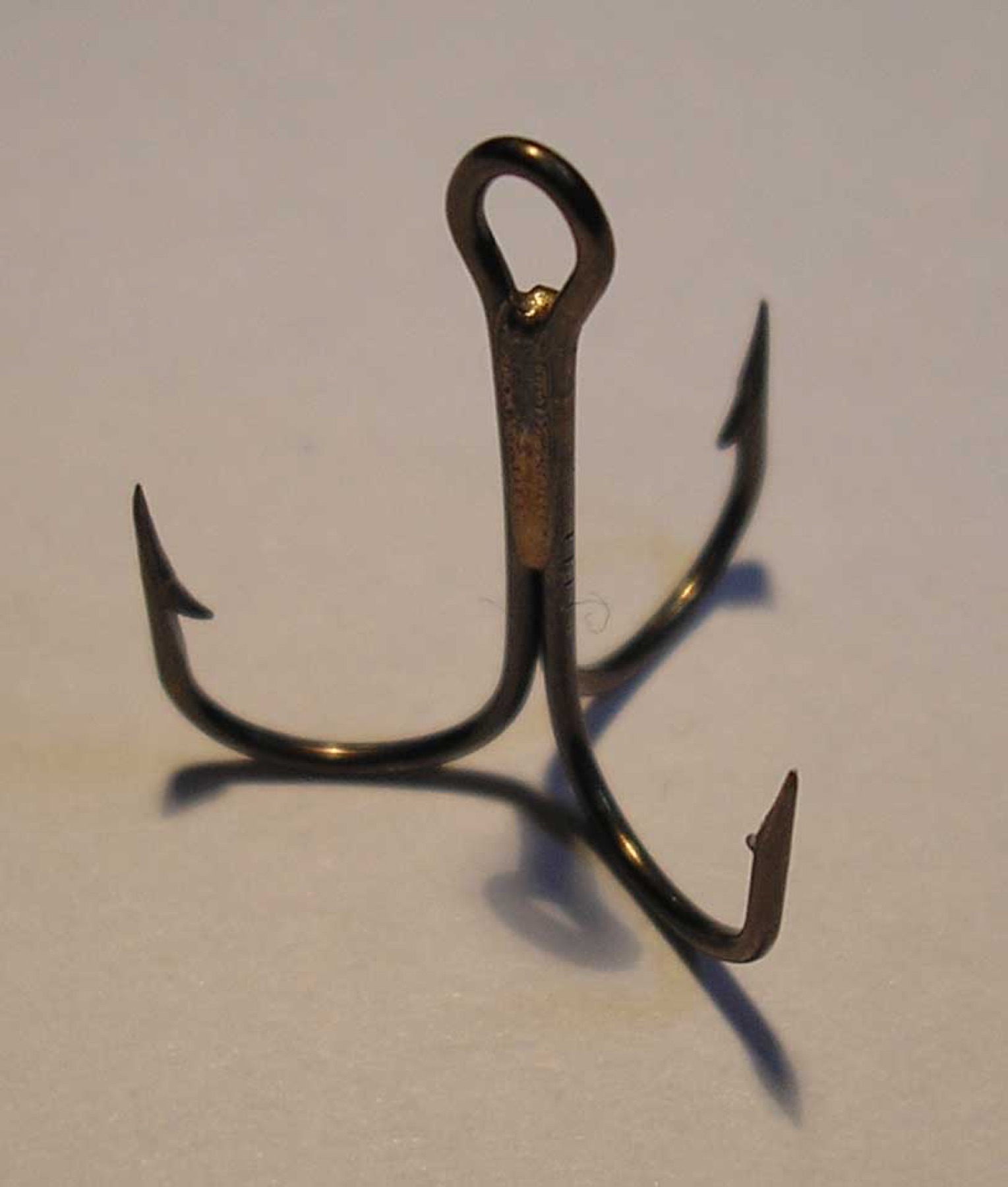 Close-up of a three-pronged treble fishing hook