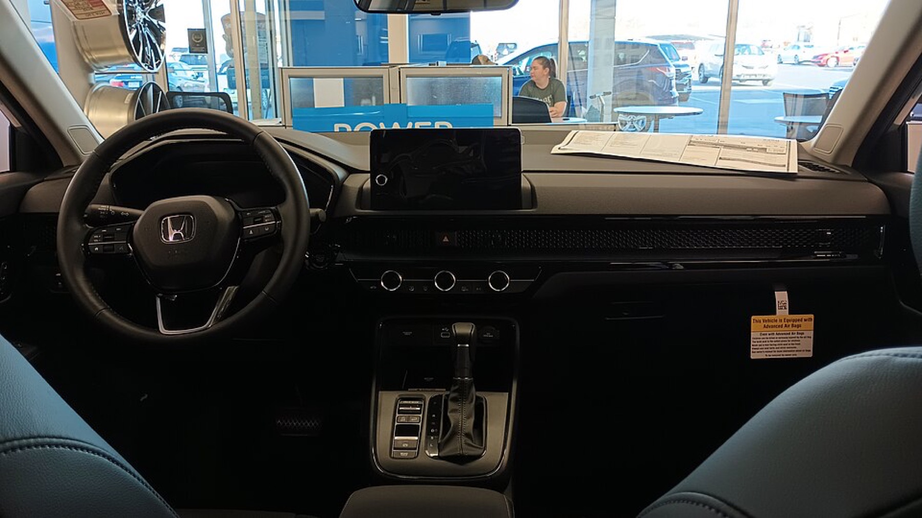 2023 Honda CR-V interior showing the factory steering wheel and dashboard