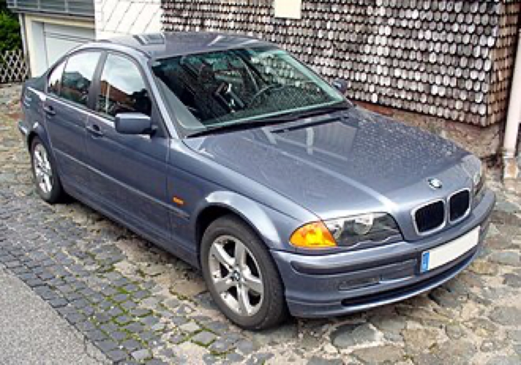 BMW E46 sedan front view showing factory headlights