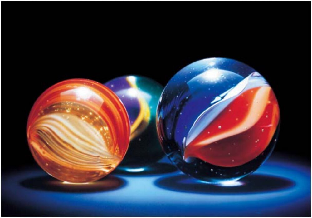 Assorted glass marbles showing variety in size and pattern