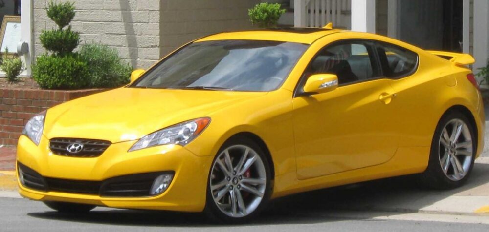 Front view of a Hyundai Genesis Coupe showing factory headlights