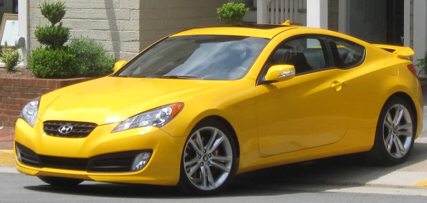 Front view of a Hyundai Genesis Coupe showing factory headlights