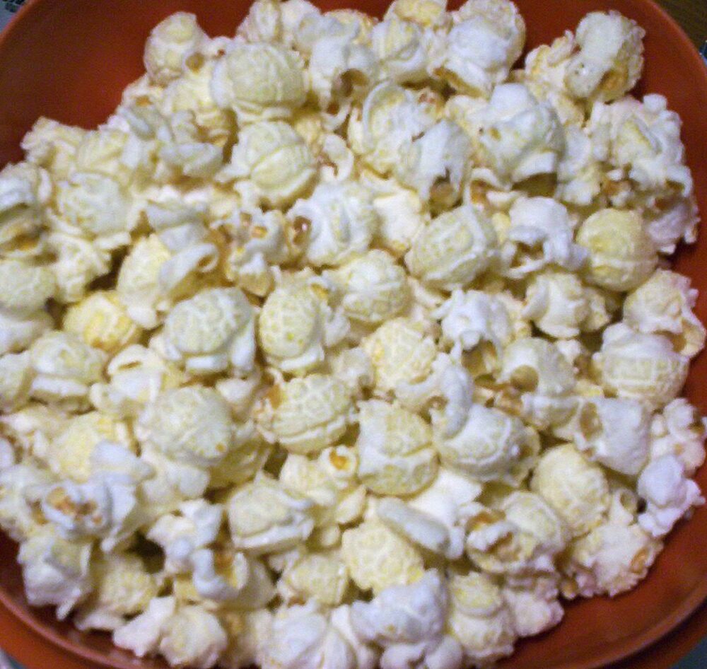 Fresh kettle corn packaged in clear bags at a stand