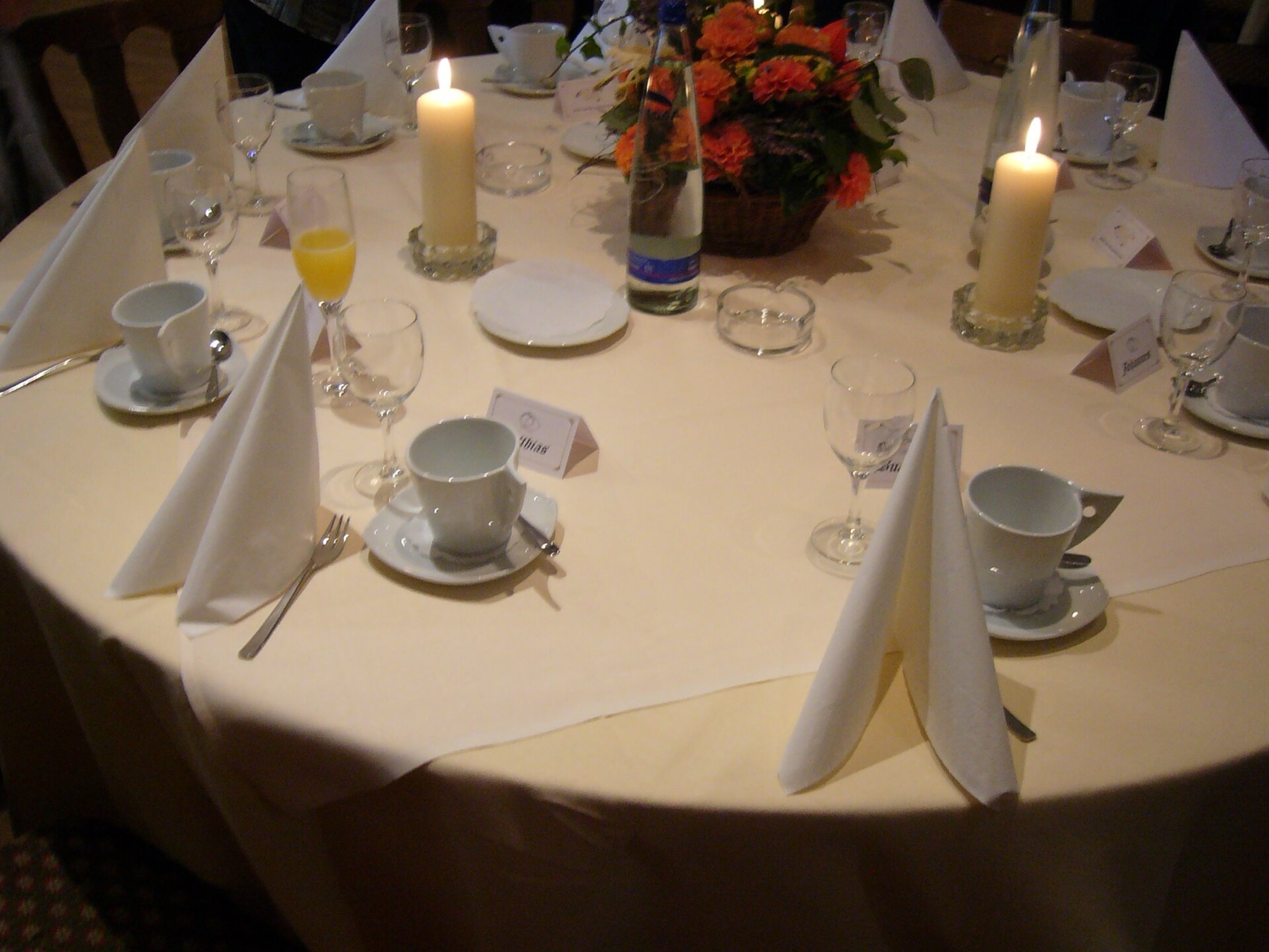 Wedding table with folded cloth napkins and place settings