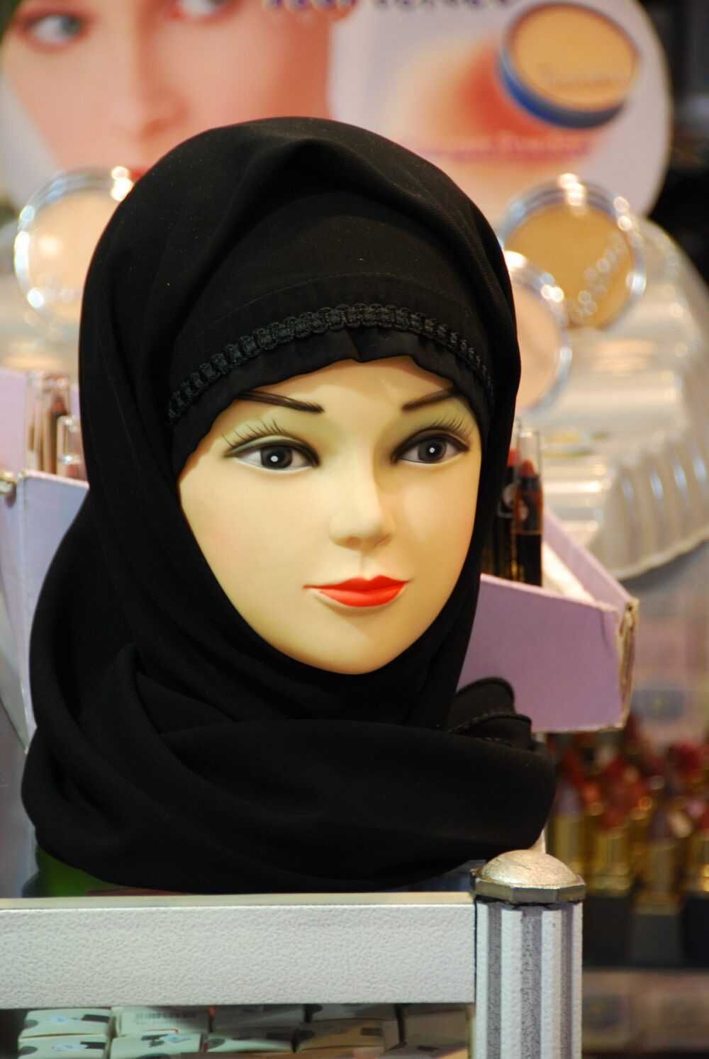 White mannequin head used to display a headscarf