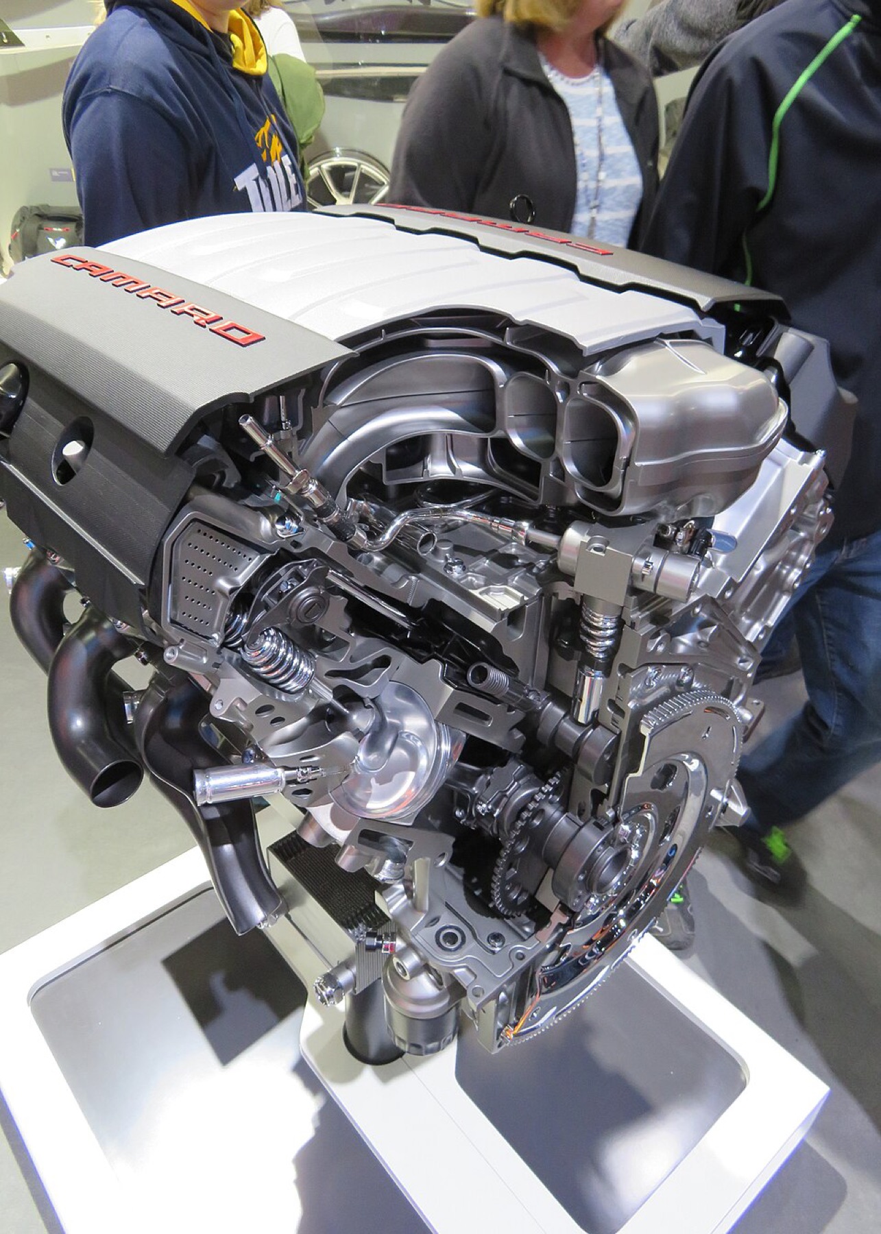 Camaro V8 engine bay with stock cover and visible dress-up potential