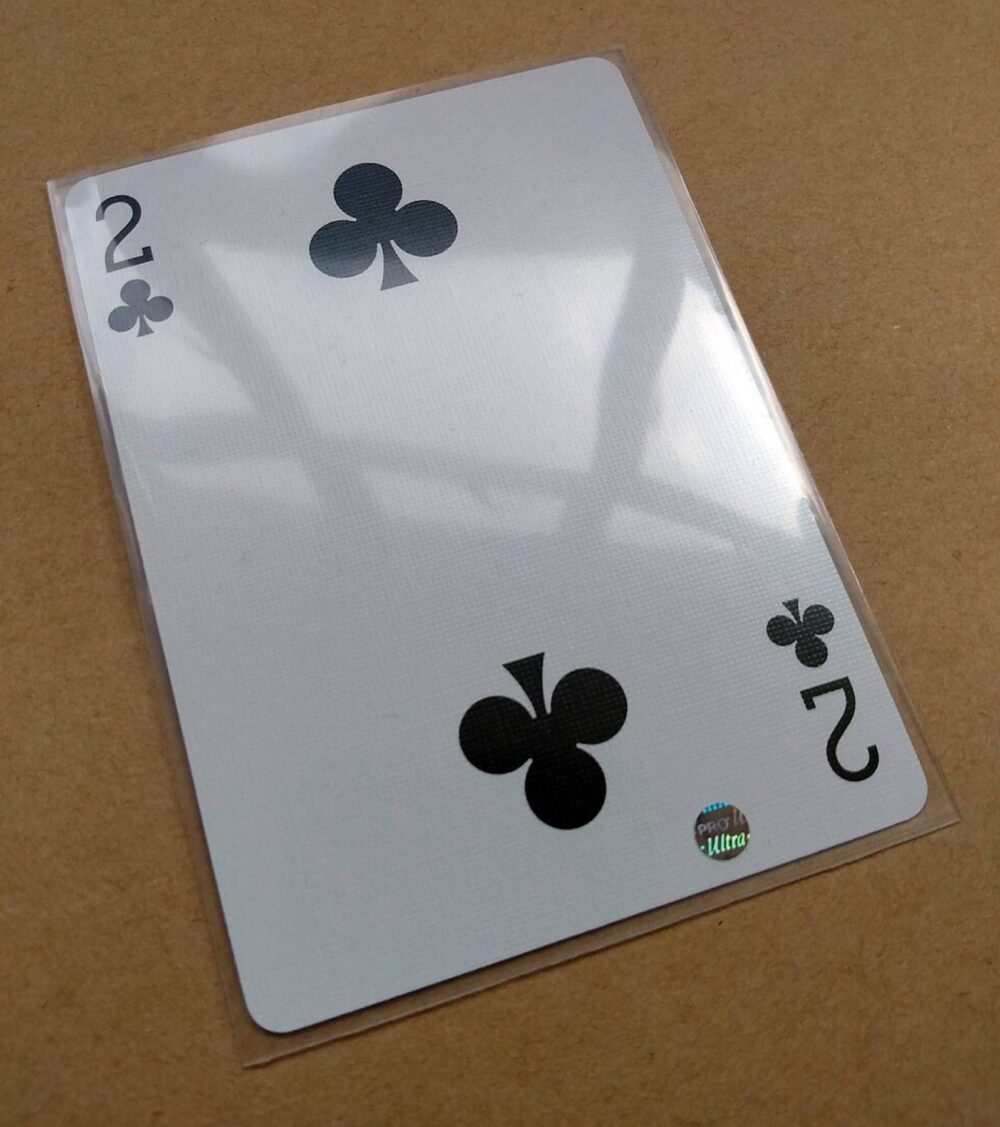 Collectible playing card inside a clear penny sleeve