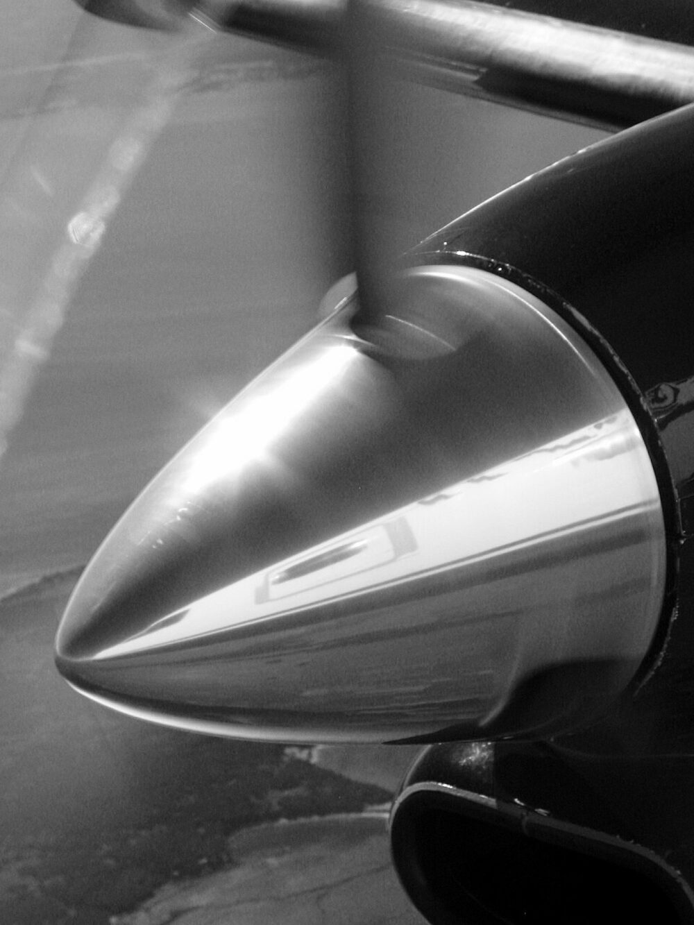 Close-up of a car wheel with a spinner-style center cap