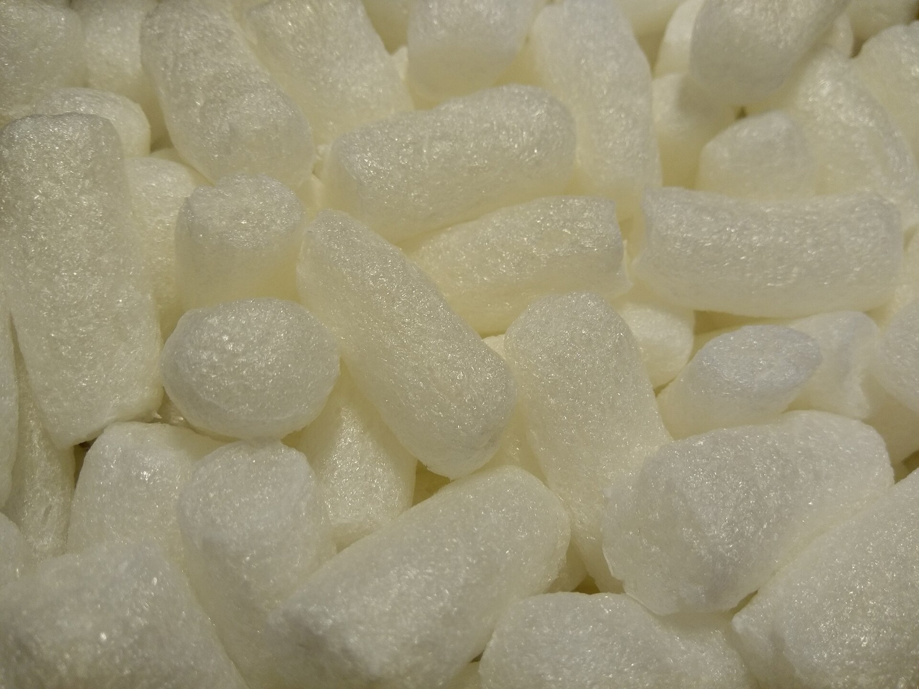 Loose plastic packaging materials spread out on a surface