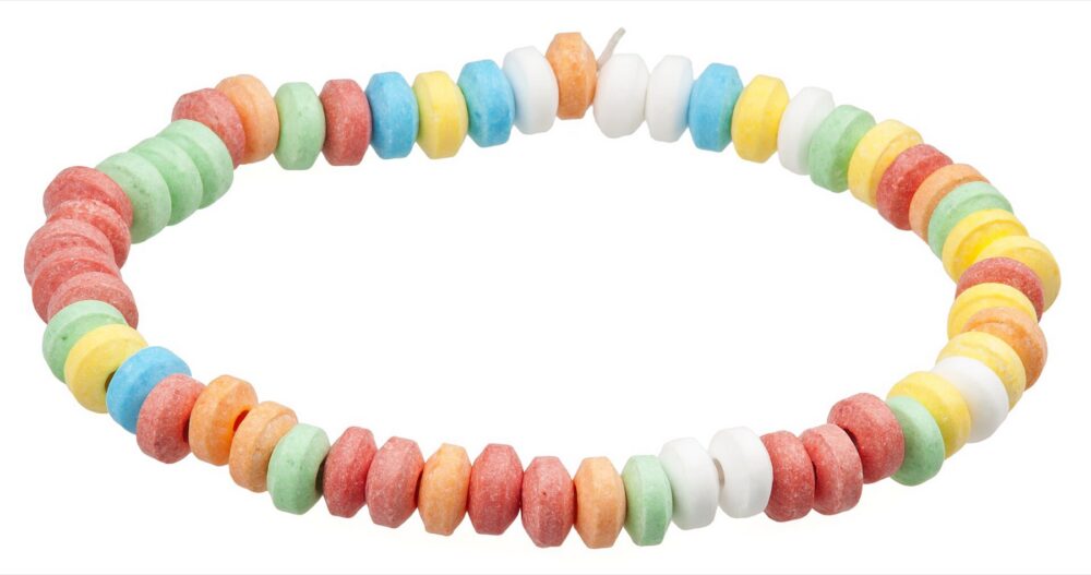 Packaged candy jewelry showing colorful beads on elastic string