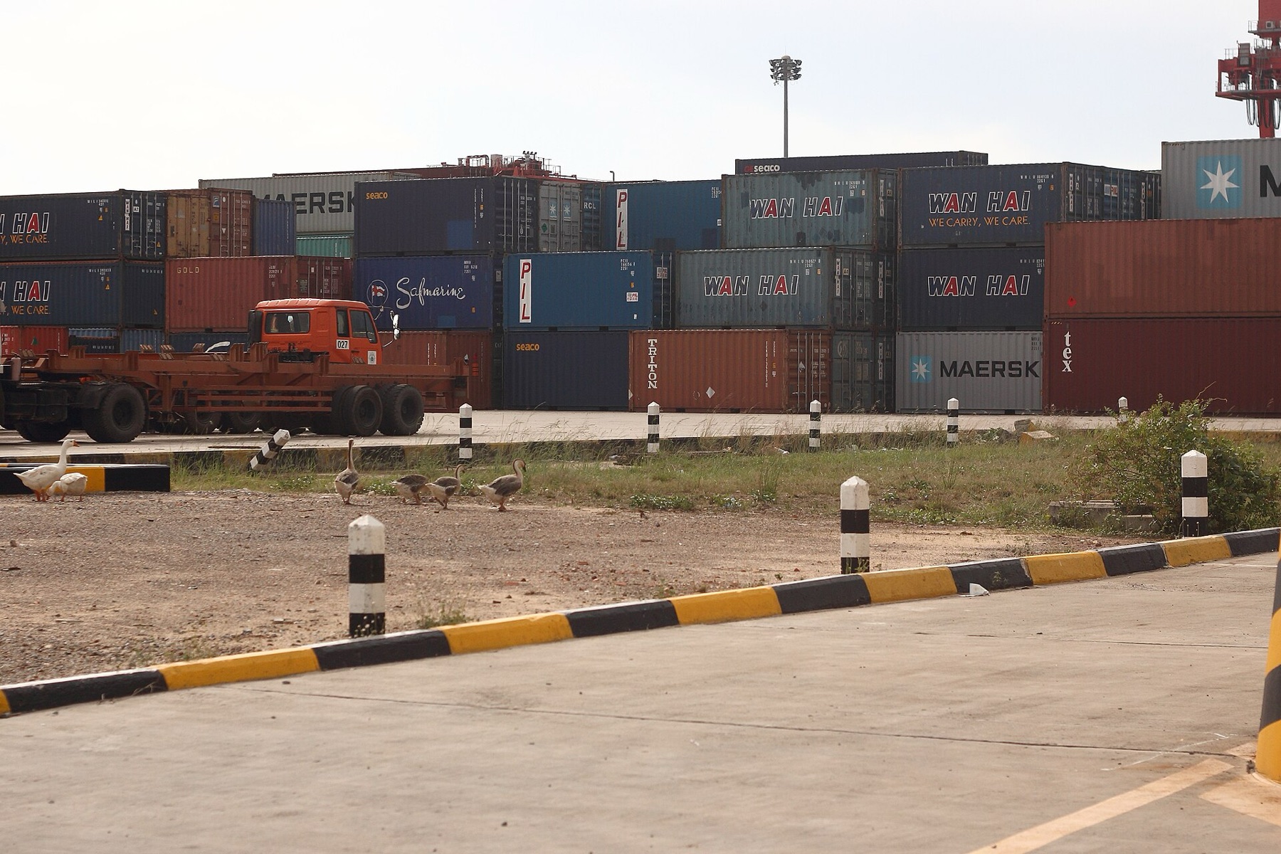 Shipping containers at an international port, illustrating global e-trade logistics