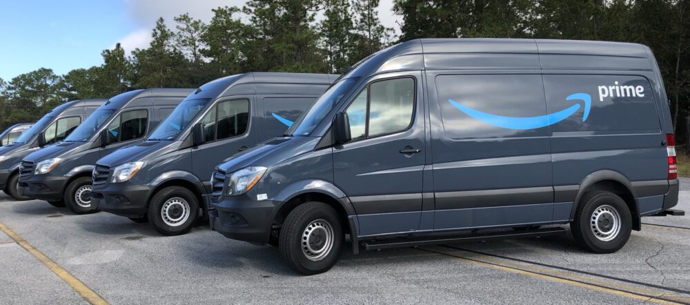 Amazon Prime delivery trucks at a loading area