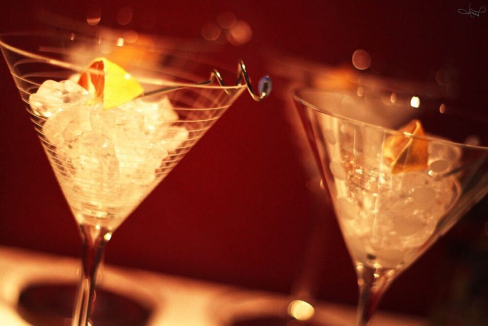 Row of martini glasses on a bar counter