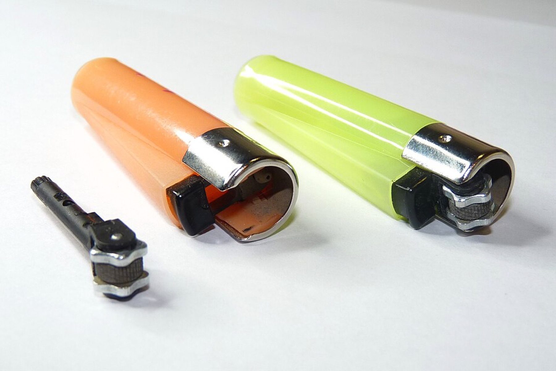Assorted branded Clipper lighters lined up in rows
