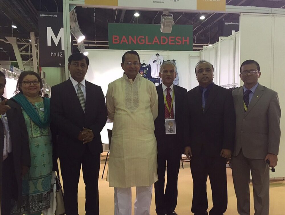 Apparel sourcing fair with global vendors and buyers discussing textiles