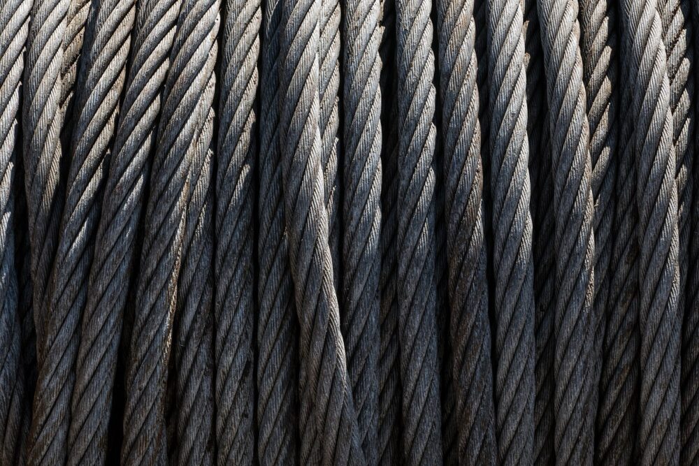 Steel wire rope showing industrial construction, contrasted with softer jute craft ropes sourced on DHgate