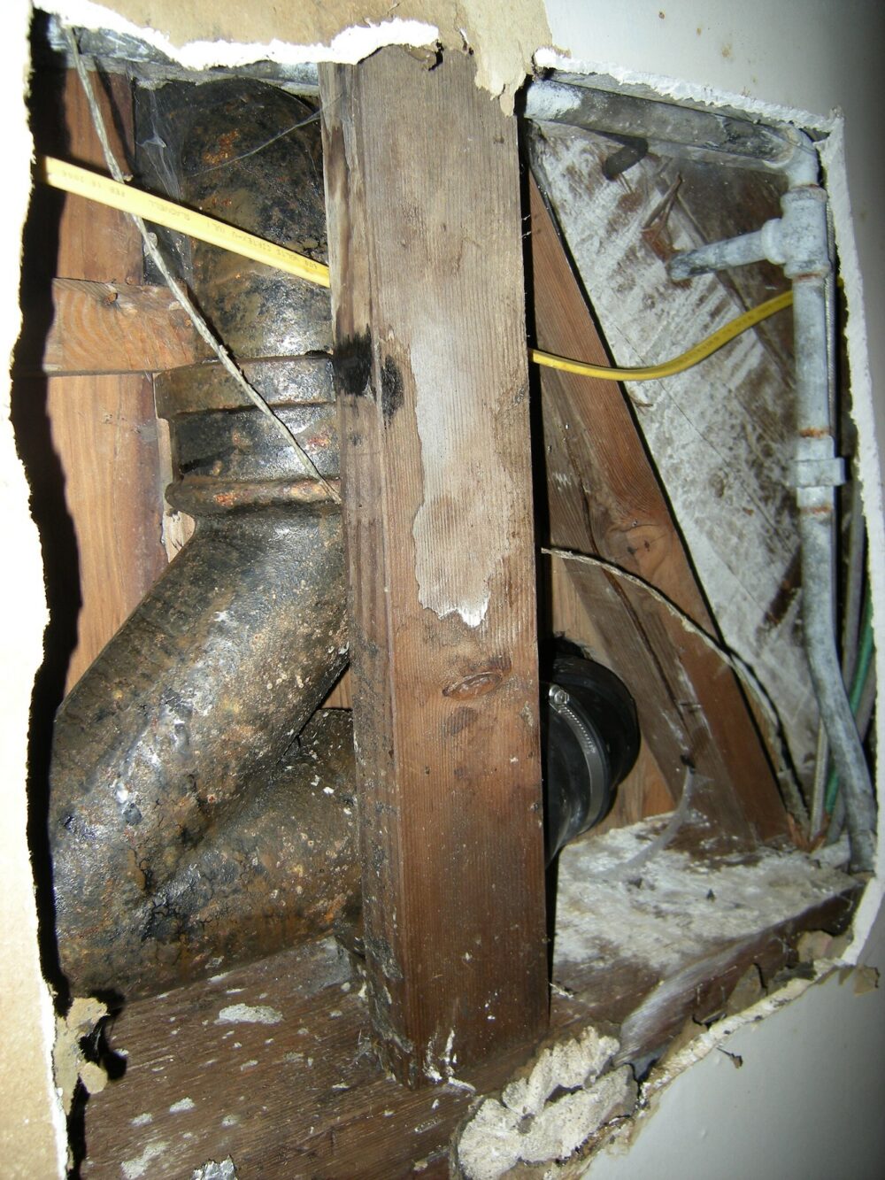 Cast-iron plumbing pipe with fittings showing typical connector context