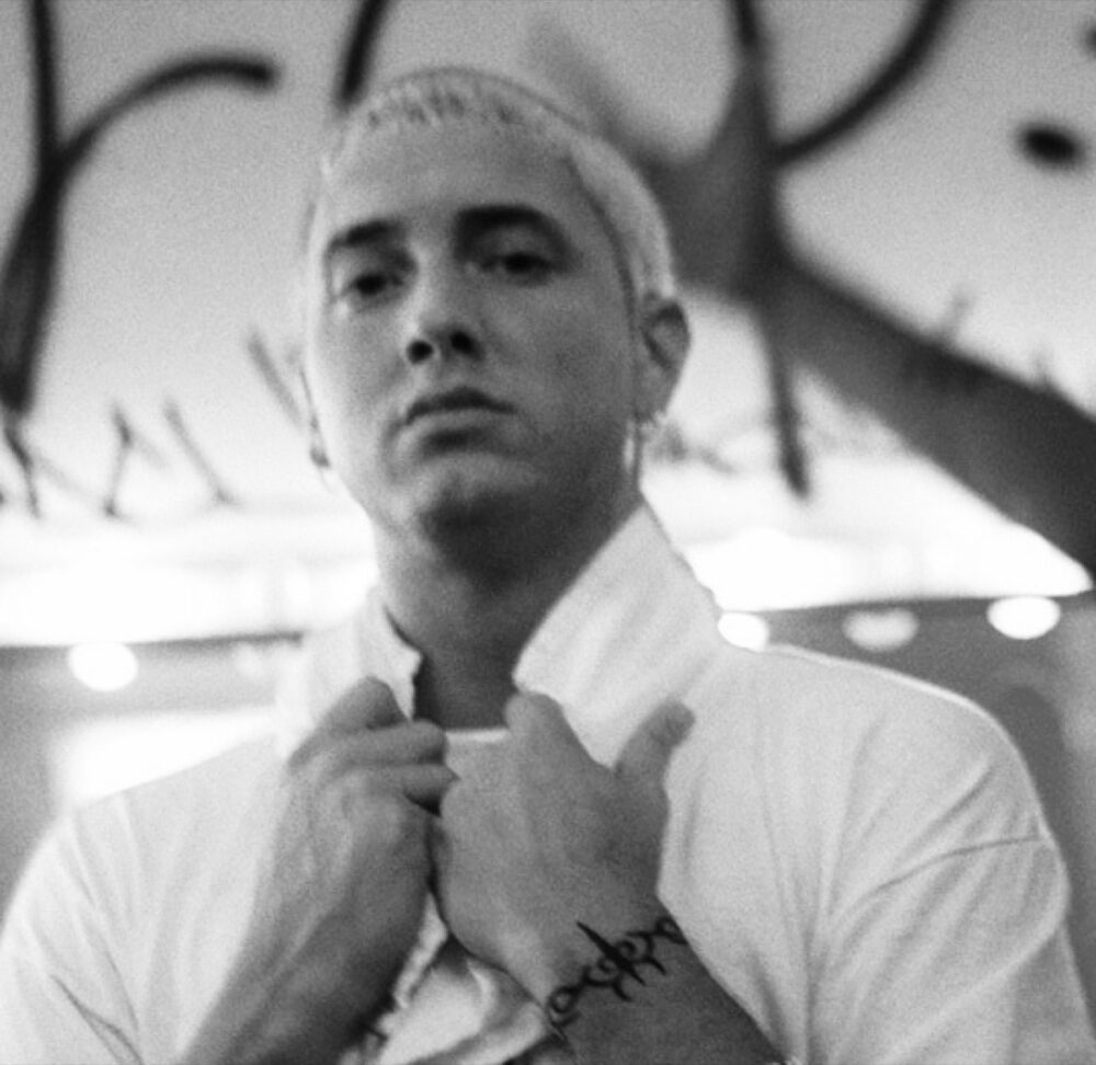Eminem performing, highlighting the kind of fan merch buyers may seek