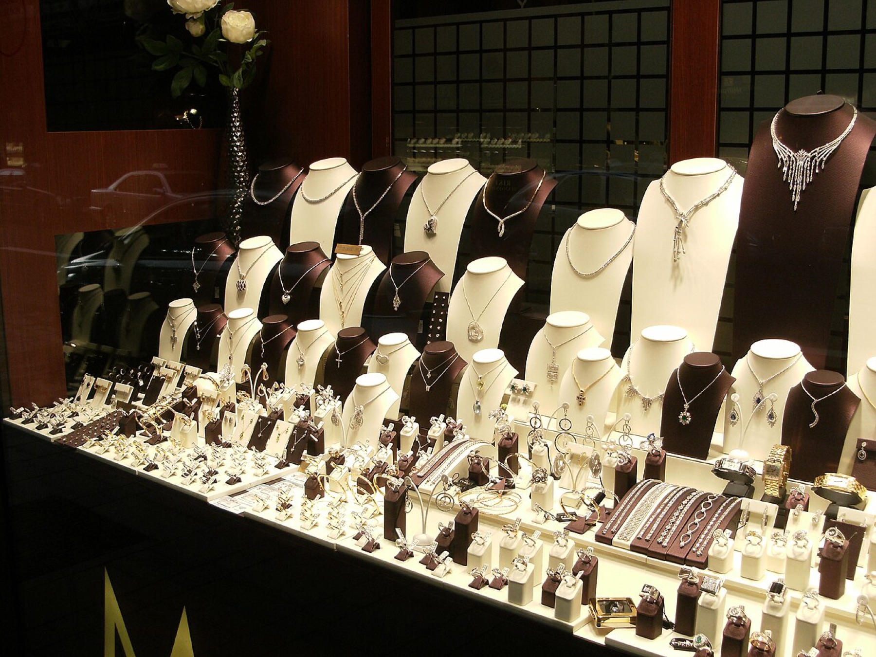 Jewelry store window with assorted pieces in a display